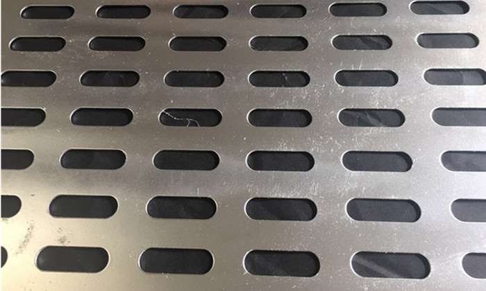 Slotted stainless steel perforated sheet product display