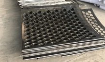 Deformation and Flattening of Perforated Sheets