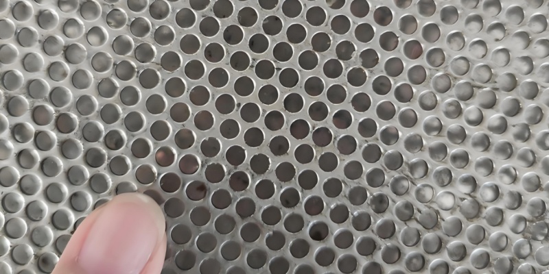 The rough side of the perforated sheet